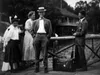 Aldo Leopold smiling at the camera standing on a dock as a young man at Les Cheneaux Club.